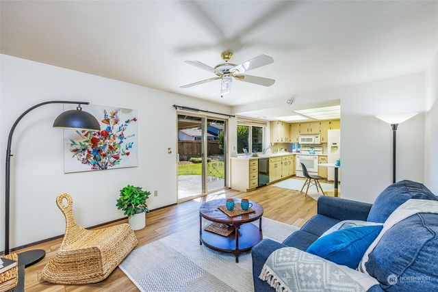 a bedroom with a bed and painting on the wall