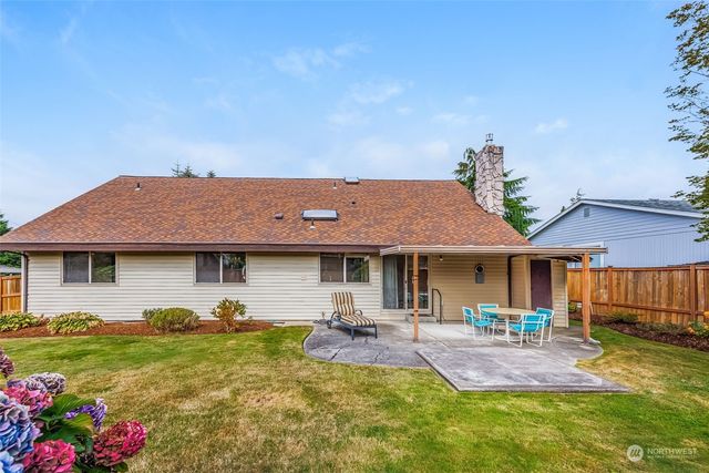 a backyard of a house with lots of green space
