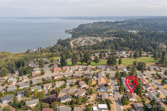 a picture of a bench in front of a wall