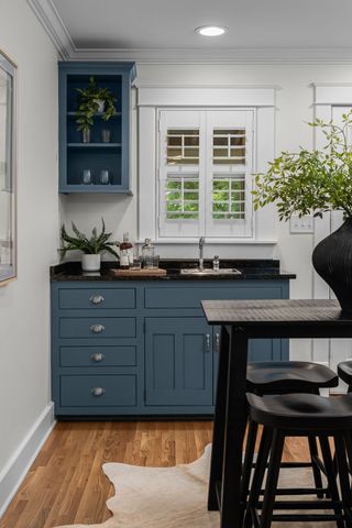 a kitchen with a sink and cabinets
