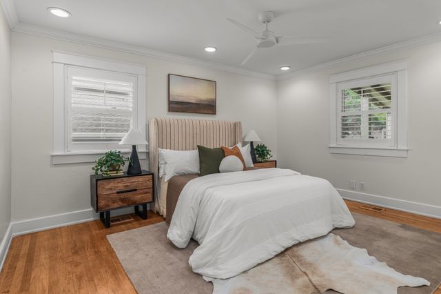 a bed room with a bed and a chair