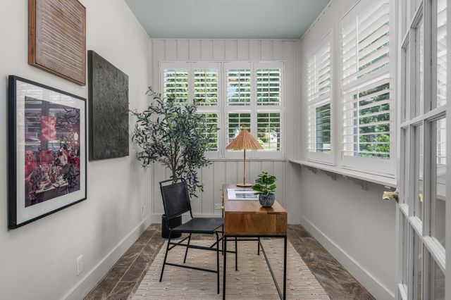 a room with furniture and a potted plant