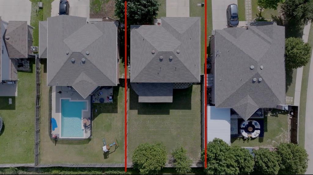 8805 Graywolf Ridge Trail Fort Worth, TX 76244 - Photo 5 of 23 Expansive backyard featuring a manicured lawn, established trees, and perimeter fencing