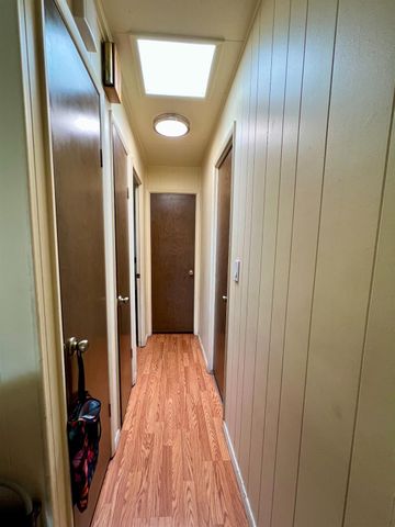 a view of gallery with wooden floor