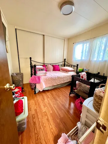 a bedroom with furniture and a bed