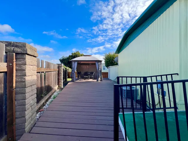 a view of balcony with wooden floor