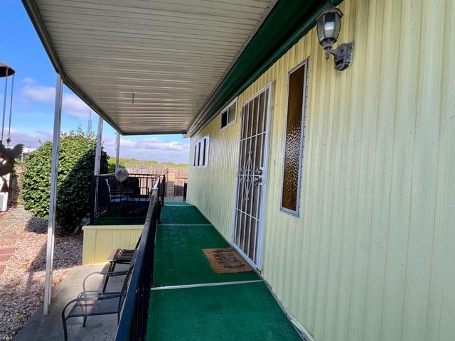 a backyard of a house with seating space