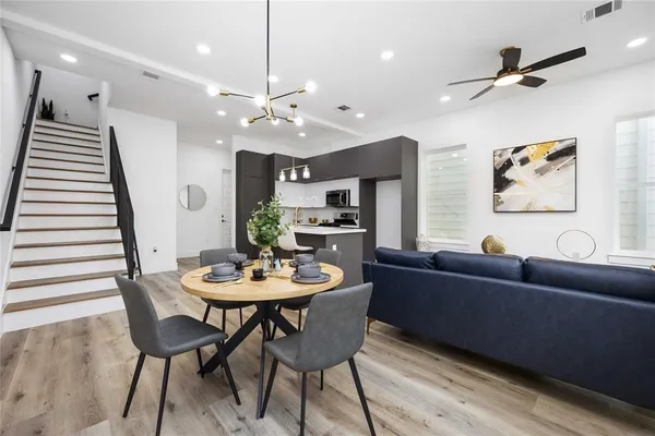 a dining room with furniture and window