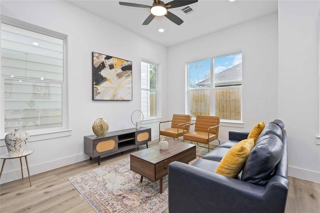 1805 Emir Street, Unit M Houston, TX 77009 - Photo 9 of 35 a living room with furniture and wooden floor