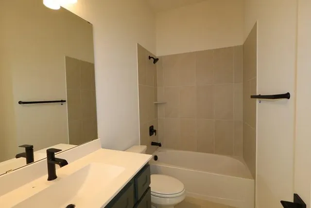 a bathroom with a sink a toilet and a bathtub