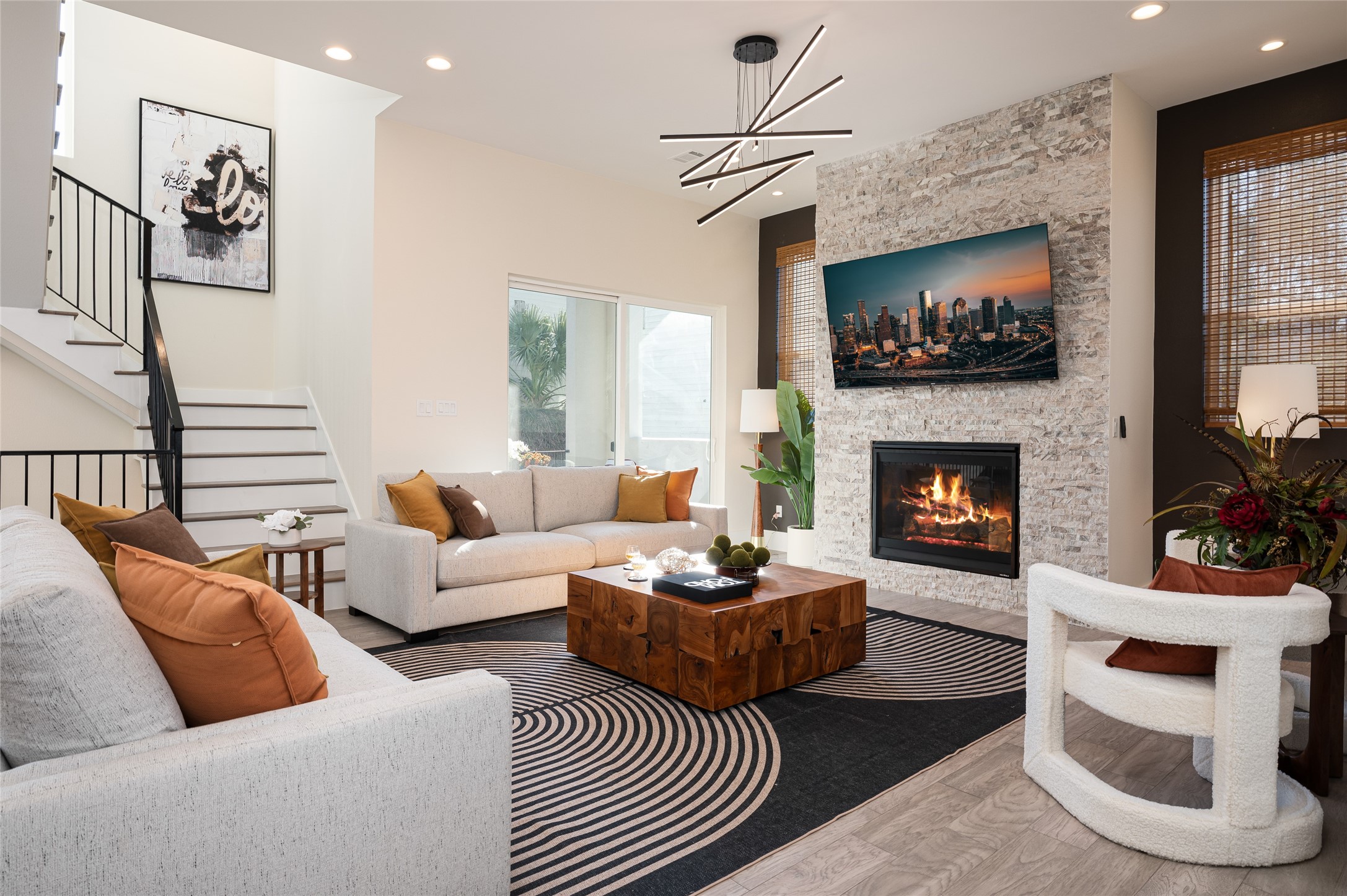 913 Thompson Street Houston, TX 77007 - Photo 12 of 49 a living room with furniture a flat screen tv and a fireplace