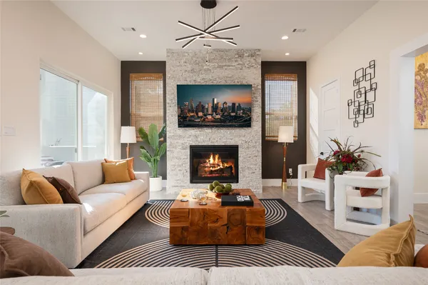 a living room with furniture and a fireplace