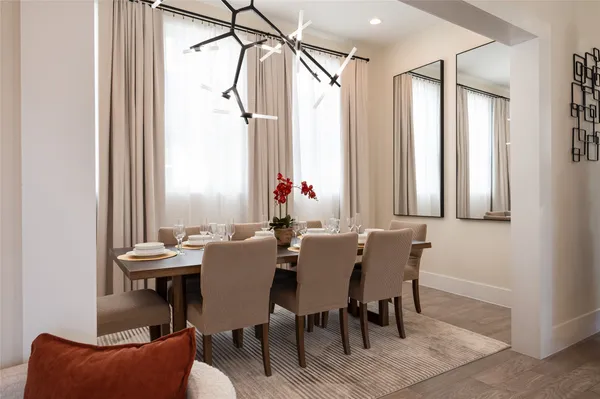 a bedroom with a bed and a potted plant