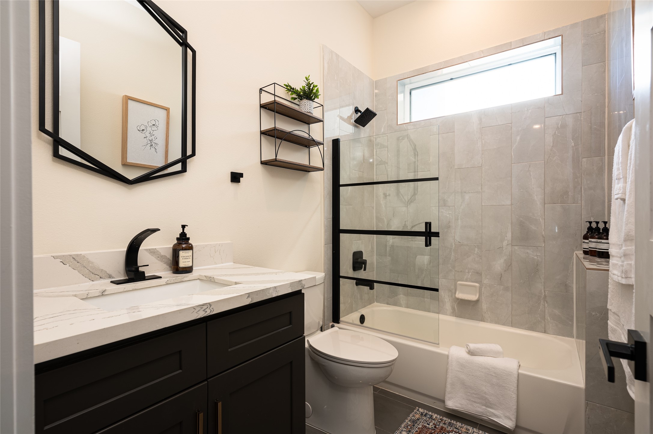 913 Thompson Street Houston, TX 77007 - Photo 43 of 49 a bathroom with a sink a toilet and shower