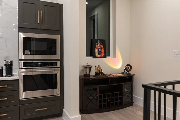 a kitchen with stainless steel appliances kitchen island granite countertop a sink and cabinets