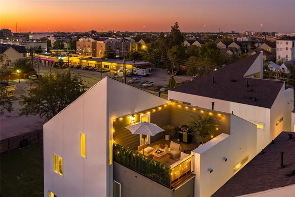 an aerial view of a house with a swimming pool