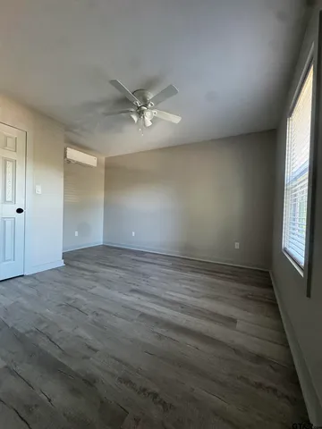 an empty room with a empty space and windows