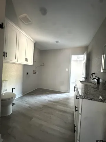 a kitchen with a sink cabinets and window