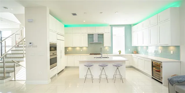 a kitchen with a sink a stove and refrigerator