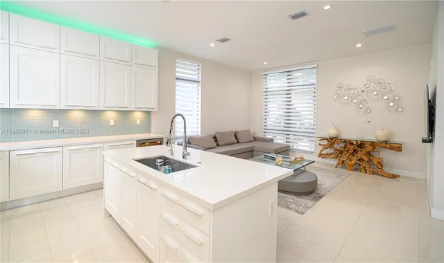 a bathroom with a double vanity sink and a large mirror