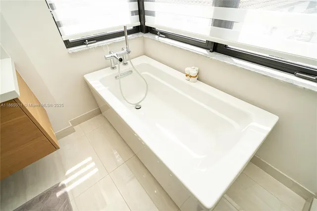 a view of a patio with couches table and chairs and potted plants