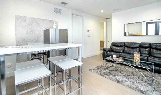 a view of swimming pool with palm trees