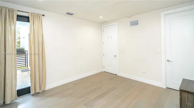 a view of a park with palm trees