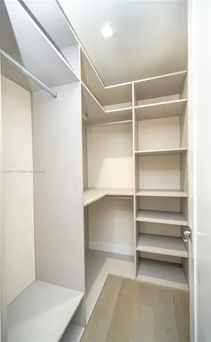 an aerial view of a house with a yard and trees