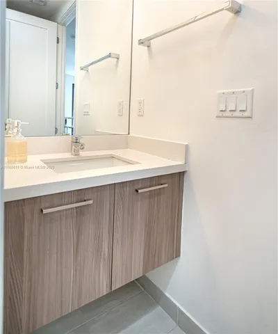 an aerial view of residential houses with yard