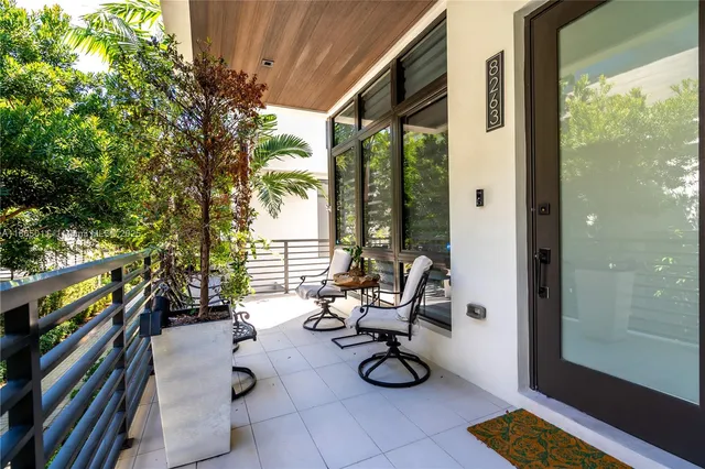 a view of living room with furniture and wooden floor