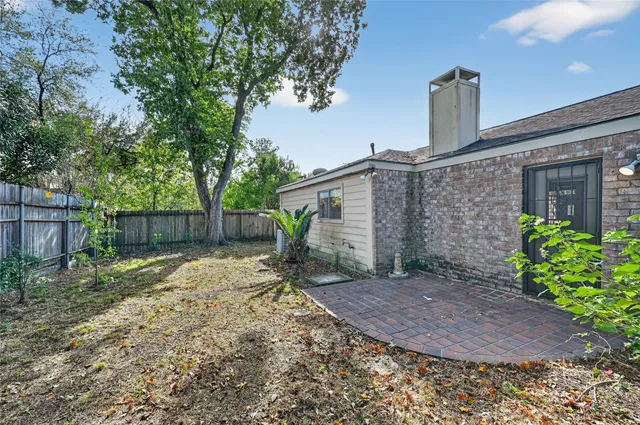 a backyard of a house with lots of green space