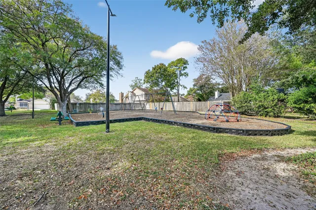 a view of a park with large trees