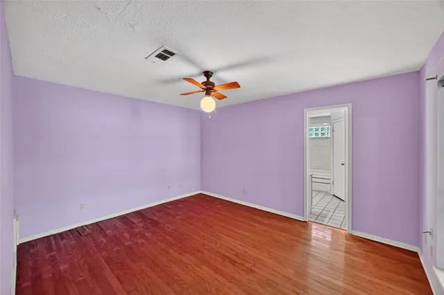 a very nice looking room with wooden floor