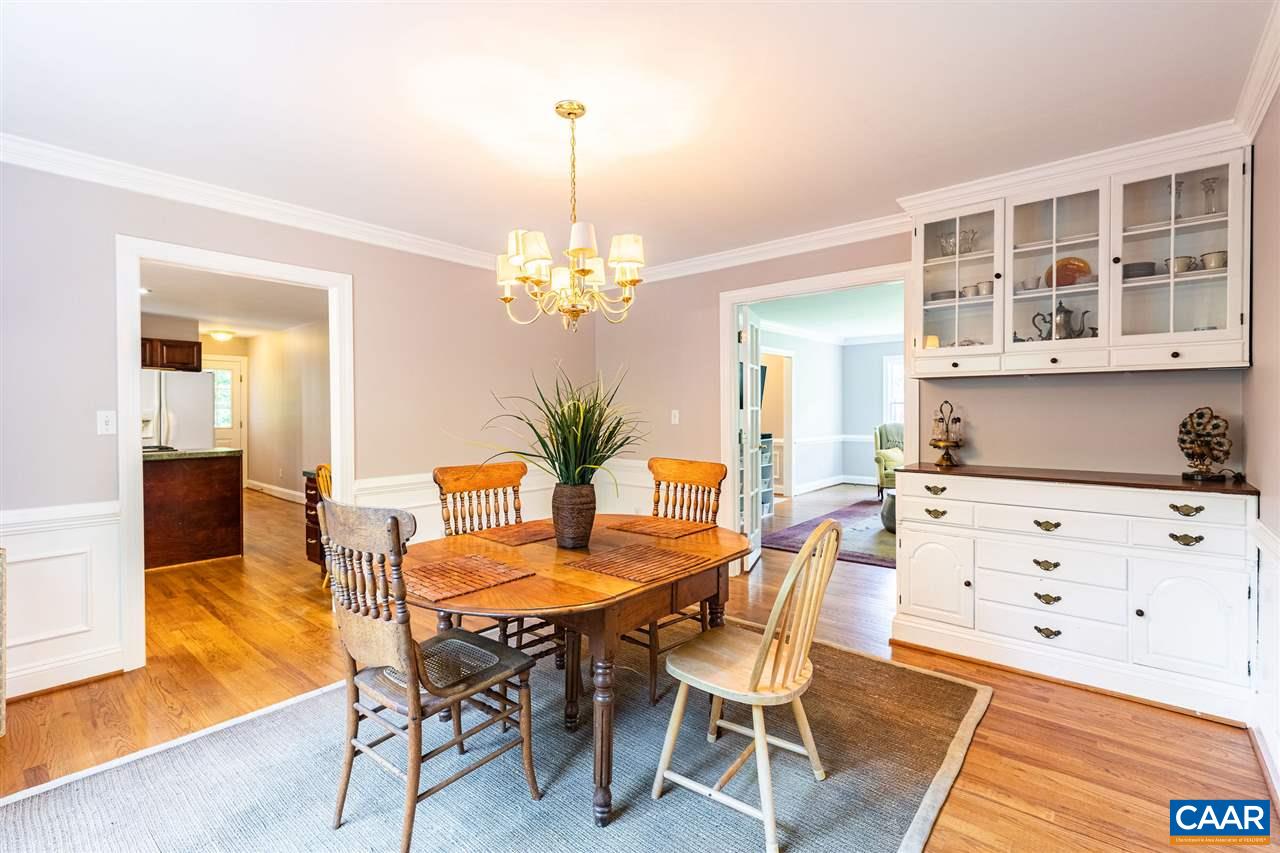 329 Starcrest Road Charlottesville, VA 22902 - Photo 16 of 45 a view of a dining room with furniture and chandelier