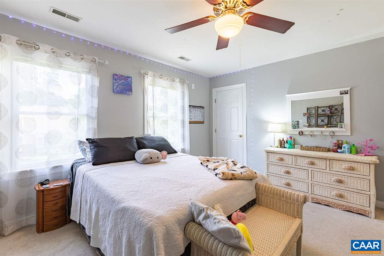 329 Starcrest Road Charlottesville, VA 22902 - Photo 33 of 45 a bedroom with a bed and ceiling fan