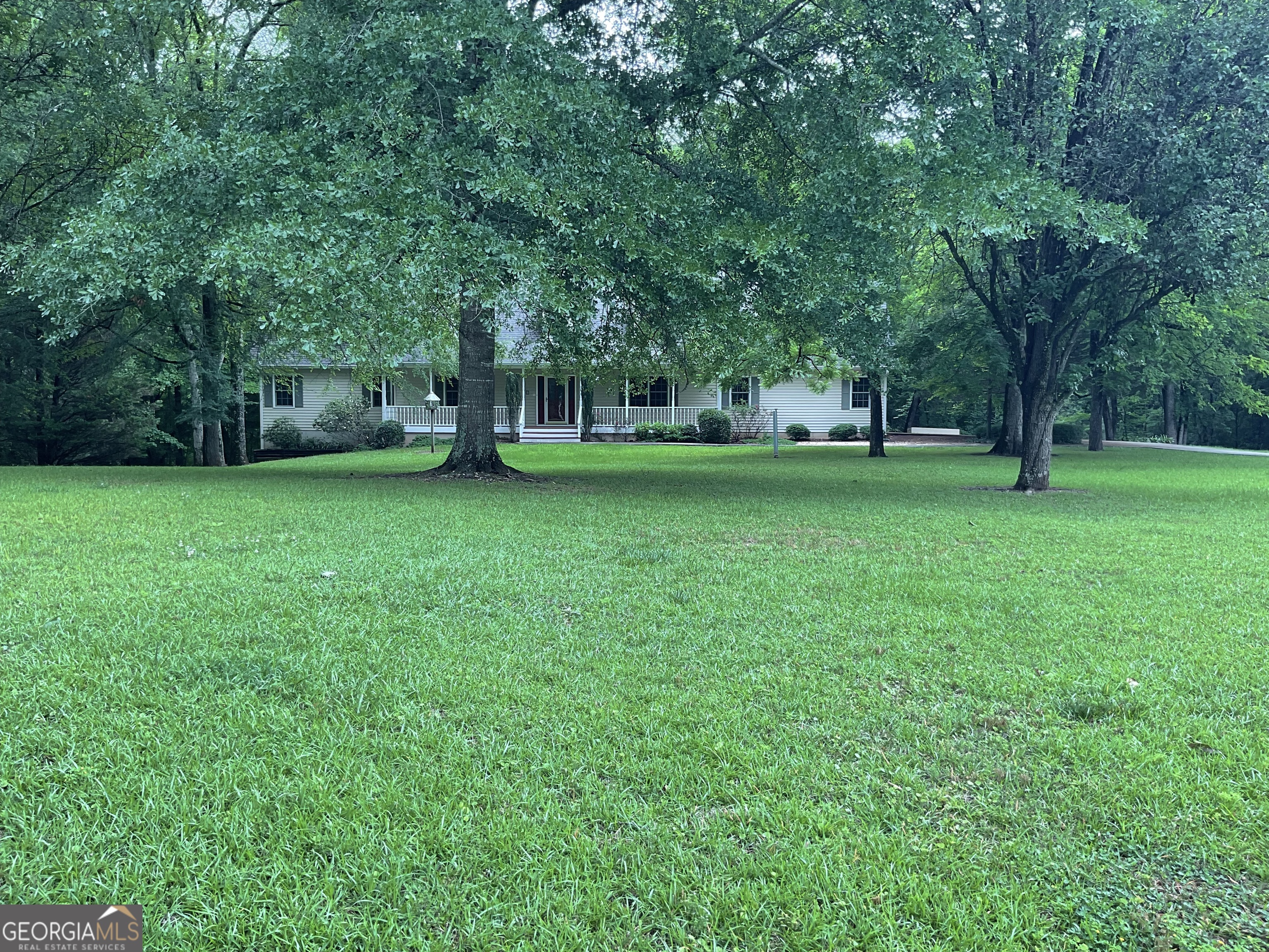 4800 Bethlehem Road Fairburn, GA 30213 - Photo 16 of 49 a view of a trees in a yard