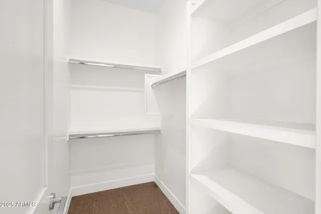 a kitchen with stainless steel appliances a sink a stove and a refrigerator