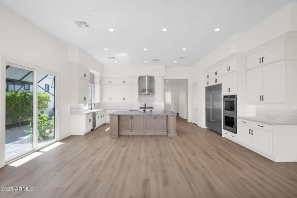 a view of an empty room with glass door