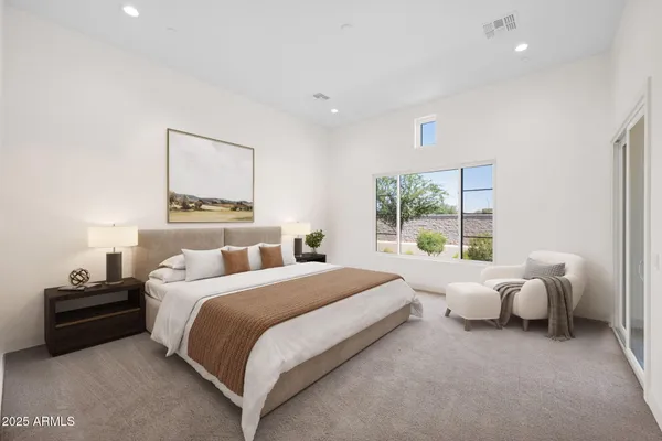 a view of a room with window and a ceiling fan