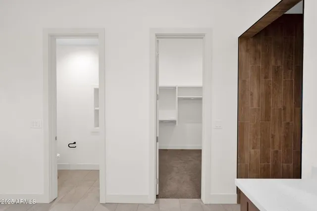 a bathroom with a double vanity sink and mirror