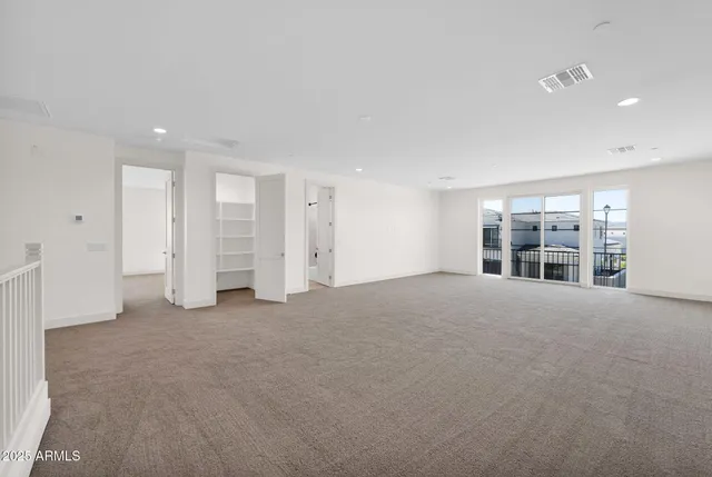 a view of a garden with an outdoor seating