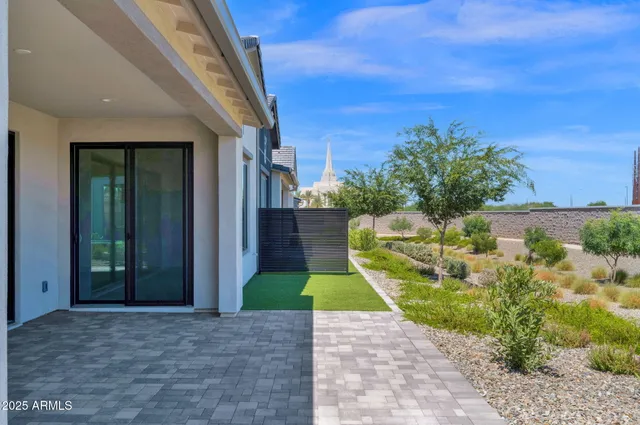 an aerial view of residential houses with outdoor space and swimming pool