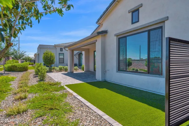 a living room with furniture fireplace and flat screen tv