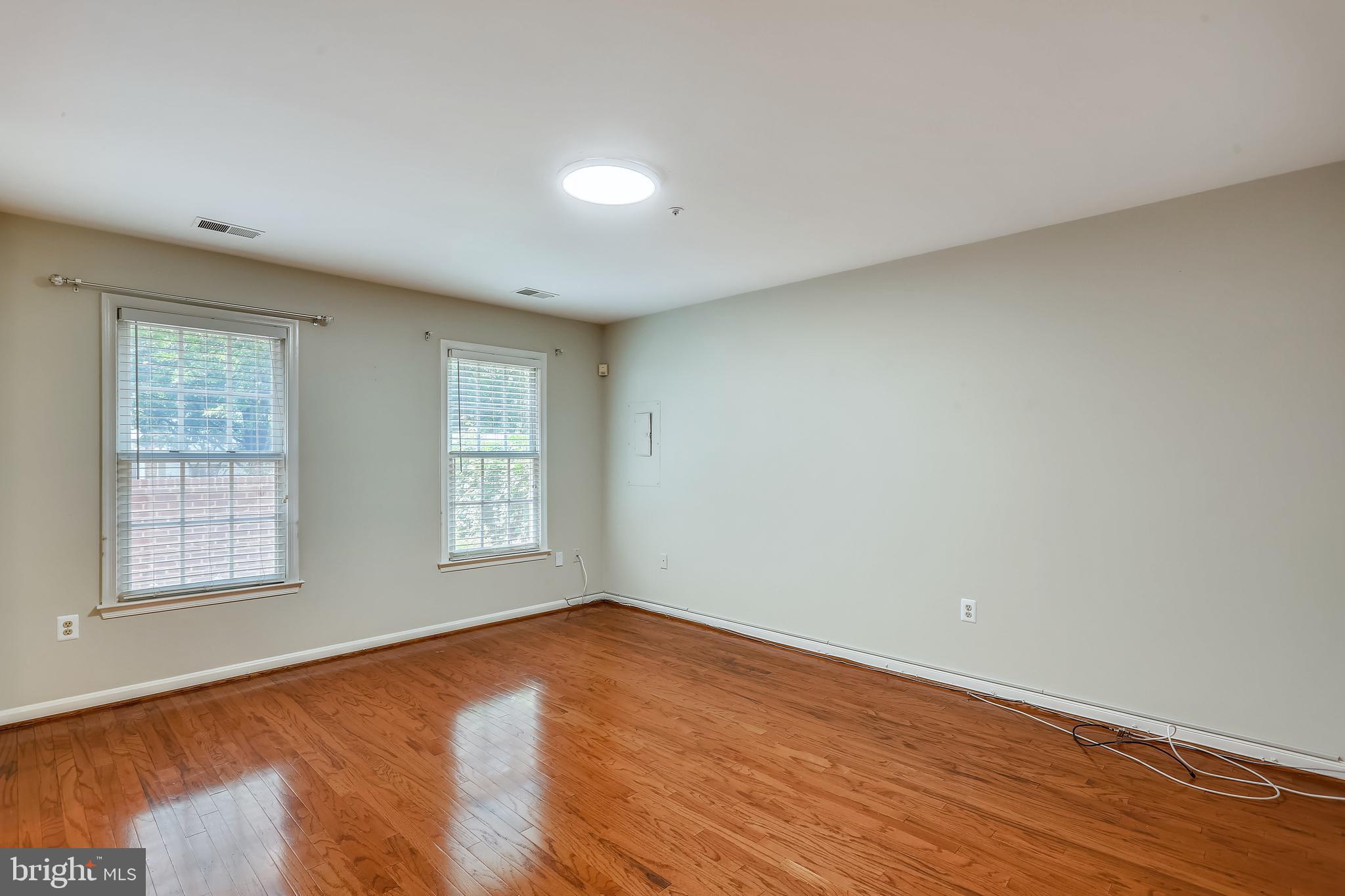 215 Ridgepoint Place Gaithersburg, MD 20878 - Photo 24 of 43 Lower level family room w/hardwood