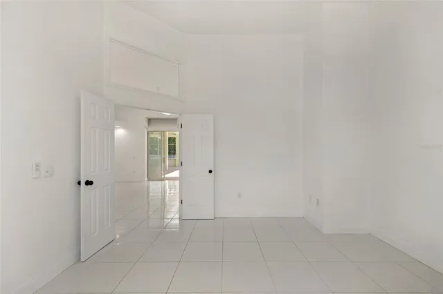 a kitchen with a refrigerator sink and cabinets