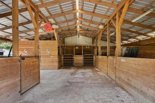 a view of a backyard with wooden fence