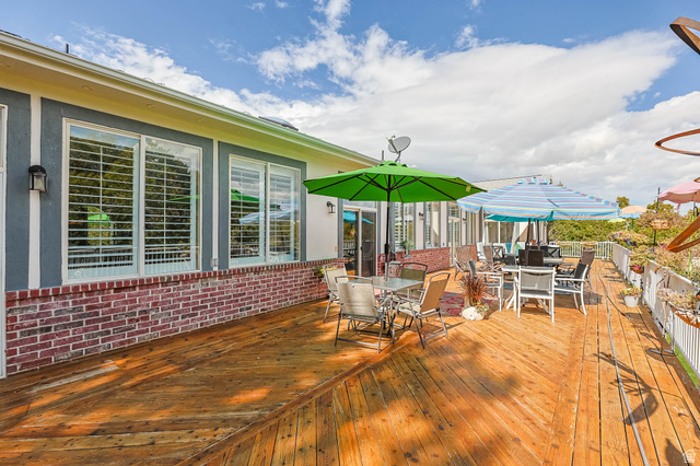 569 Elk Meadow Loop Tooele, UT 84074 - Photo 10 of 56 Wooden deck with outdoor dining area