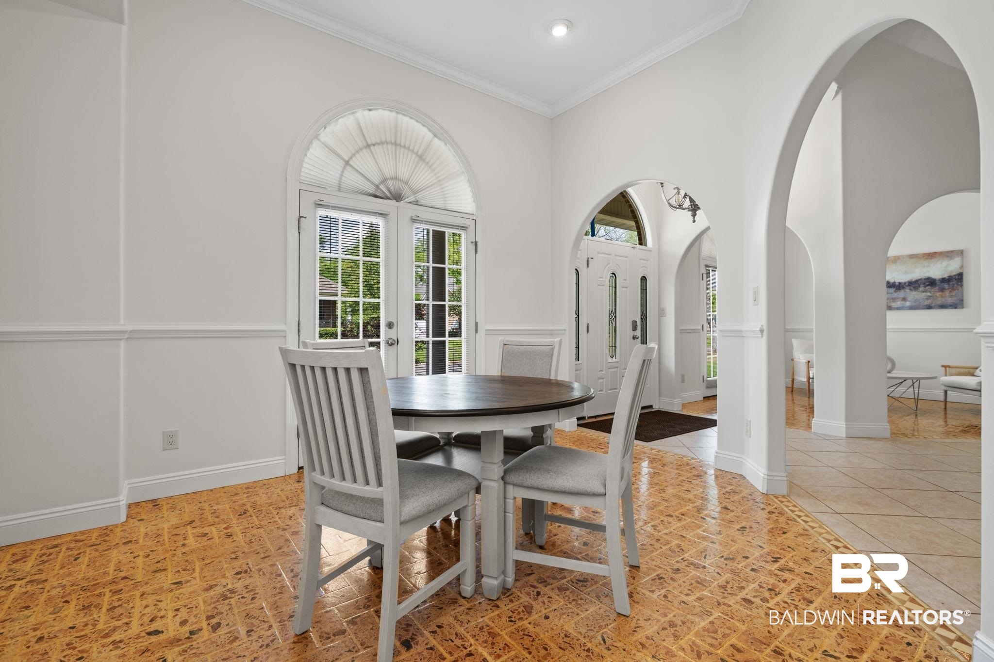 29634 St George Street Daphne, AL 36526 - Photo 12 of 47 Dining area with ornamental molding, arched walkways, and french doors