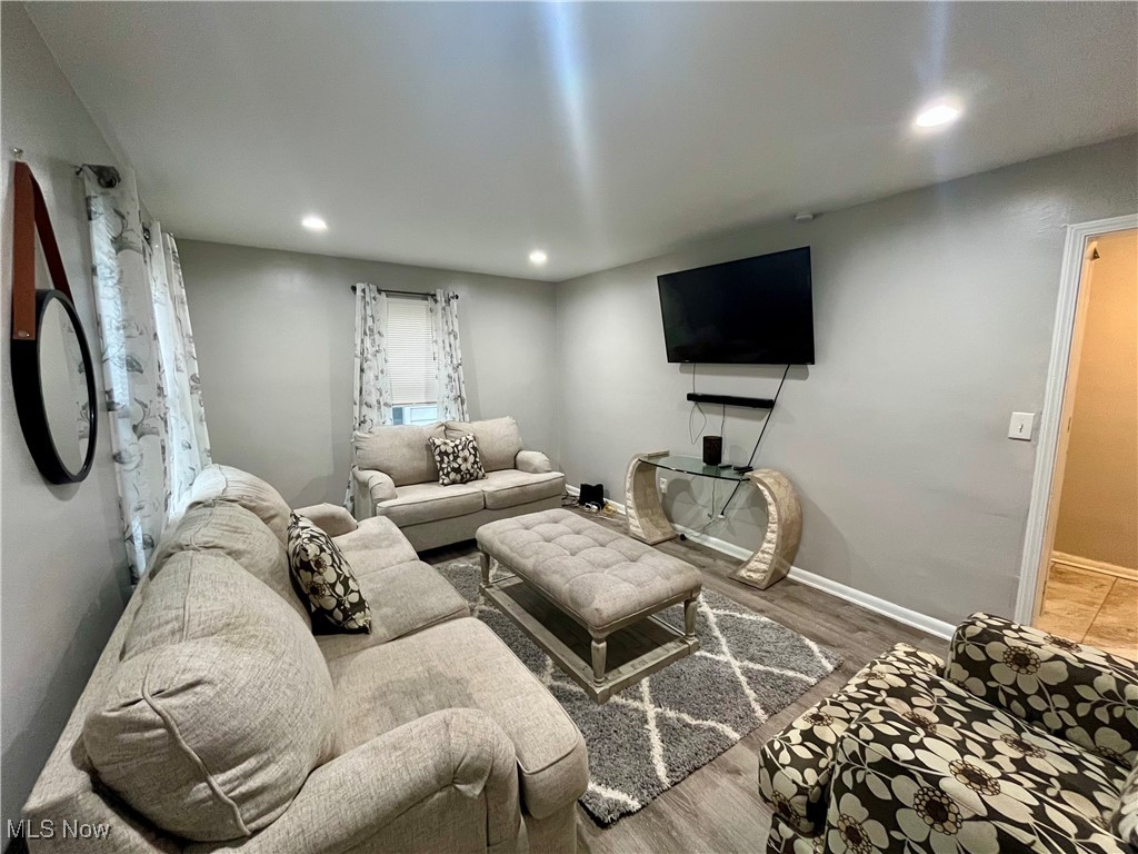 20907 Watson Road Maple Heights, OH 44137 - Photo 5 of 20 Living room featuring wood finished floors and recessed lighting