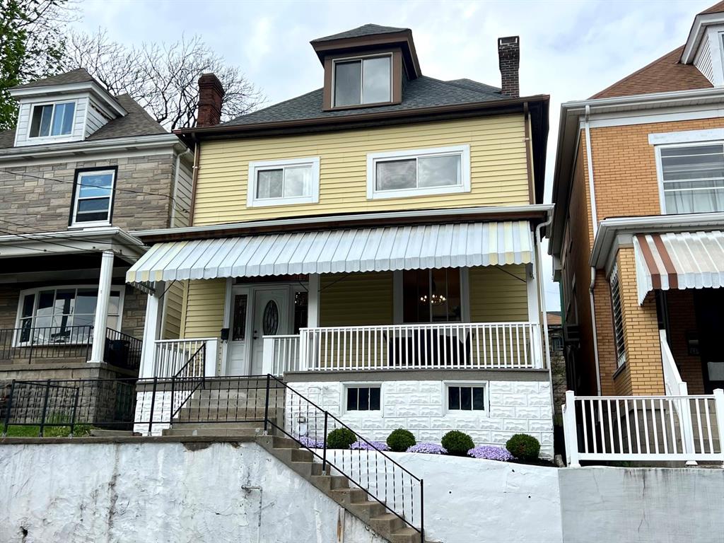 237 Lelia Street Pittsburgh, PA 15211 - Photo 46 of 46 a front view of a house with iron fence
